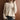 Ivory ribbed turtleneck sweater in beige, featuring long sleeves and a cozy, chic design for women's winter fashion, shown in a 2XL size.