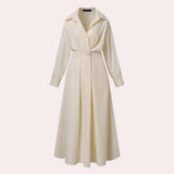 Ivory satin trench coat with a classic design, featuring a collar, long sleeves, and a tailored waist, displayed on a clothes hanger.