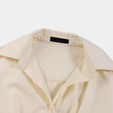 Ivory satin trench coat featuring a sophisticated design with long sleeves, a classic collar, and button detailing. The coat has a subtle beige hue, highlighting its elegant and luxurious appearance, perfect for winter wear.