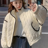 Ivory women's cropped quilted puffer jacket with contrast piping, shown in a gray-white color, size XL, featuring a stand collar and long sleeves.