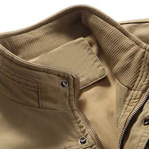 Khaki men's lightweight bomber jacket with a ribbed collar and snap button closure, featuring long sleeves and a beige tint.