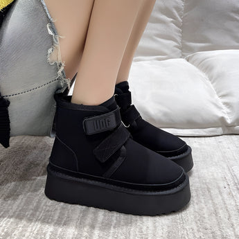 Khaki suede platform ankle boots with a buckled strap, designed for women's winter fashion, displayed on a model wearing the Nero size 40 variant. The boots feature a stylish blend of grey and silver tones, enhancing their modern fashion appeal.