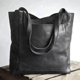 Black large caramel handmade leather tote bag for women, featuring a rectangular shape and designed as a stylish work shoulder bag.