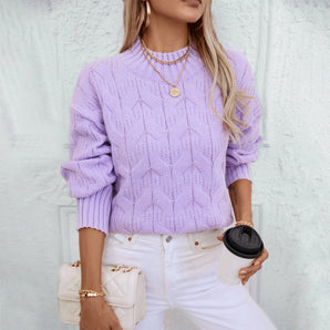 Lavender cable knit puff sleeve sweater for women, featuring intricate knit patterns on the sleeves and body. The sweater is styled with puffed sleeves and a round neckline, adding a fashionable touch to the outfit. The color is a soft purple hue.