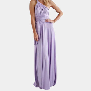 Lavender convertible maxi dress in purple color, styled as an infinity bridesmaid gown, shown on a model wearing size XL. The dress features a versatile design that can be wrapped in multiple ways, highlighting its elegant long flow and sleeveless cut.