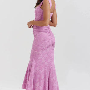 Lavender floral ruched mermaid gown with a sleeveless design, featuring a form-fitting silhouette and a flared hem, suitable for prom or formal occasions.