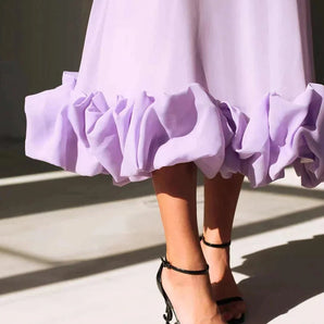 Lavender ruffle dress in lightweight fabric featuring short sleeves and a fitted waist, perfect for summer streetwear fashion.