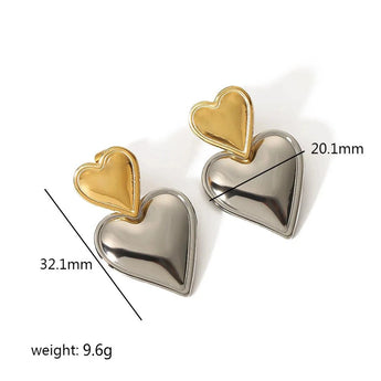 Layered dual-tone heart dangle earrings in silver and gold featuring interlocking heart designs, perfect for fashion accessories or special events.