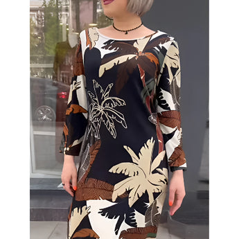 Leaf Print Long Sleeve Midi Dress in black and white, featuring a sheath design with a chic nature-inspired pattern, long sleeves, and a high neckline ideal for day wear.