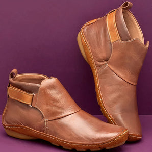 Brown handmade leather ankle boots with slip-on design, low heel, and buckle detail, shoe size 43.