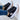 Women's LED sneakers with neon sole, rechargeable, fashionable light-up shoes, black color, size 43, worn with jeans.