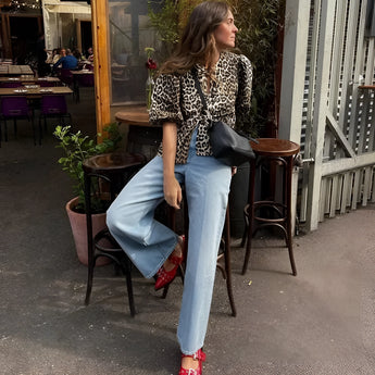 Leopard print animal top with long sleeves, styled for trendy autumn casual streetwear, featuring a model wearing sunglasses and paired with a blazer.