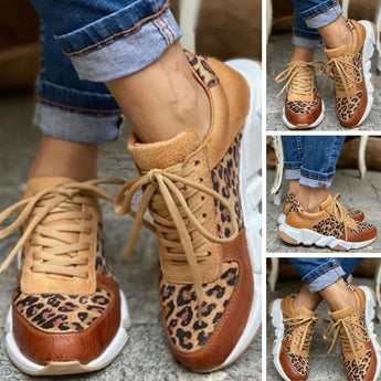 Leopard print chunky sole tan leather fashion sneakers with a mix of brown, black, and white colors, featuring a stylish and trendy design.