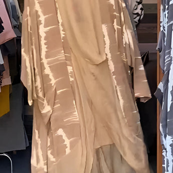 Leopard print designer kimono featuring a chic animal print with a brown tie-dye pattern, displayed on a clothes hanger, highlighting its flowing silk fabric and elegant sleeve design in a 3XL size.
