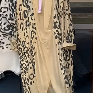 Leopard Print Designer Kimono in brown leopard pattern, featuring a relaxed fit with long sleeves, open front, and draped silhouette, displayed on a clothes hanger. Perfect as a chic animal print cover-up.