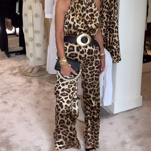 Leopard Print Halter Jumpsuit featuring a stylish belt, perfect for chic evening wear, displayed on a mannequin with a focus on the waist and neckline design.