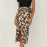 Leopard print high-waist midi skirt with a trendy design, styled with a fashionable one-piece garment for women.