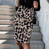 Leopard Print High-Waist Midi Skirt worn by a model standing with hands on hips, showcasing the trendy women's fashion piece.