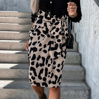 Leopard Print High-Waist Midi Skirt worn by a model standing with hands on hips, showcasing the trendy women's fashion piece.