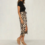 Leopard Print High-Waist Midi Skirt worn by a woman, showcasing a trendy, stylish design with a focus on the waist and skirt length, suitable for a fashionable outfit.