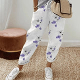 Leopard print joggers featuring a stylish animal print design, suitable for women's loungewear.