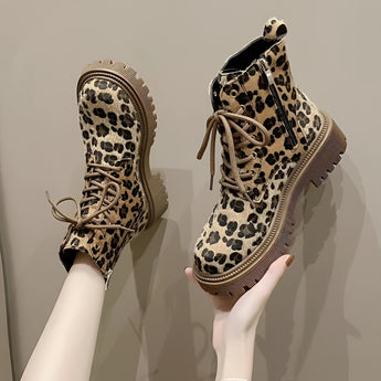 Leopard print lace-up women's combat boots with chunky sole, showcasing a bold fashion design in size 42.