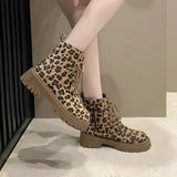 Leopard print lace-up women's combat boots with chunky sole, showcasing a bold fashion design.