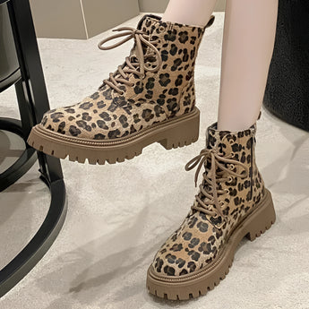 Leopard print lace-up women's combat boots featuring a chunky sole and fashionable design, showcasing a bold animal pattern.