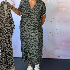 Leopard print mid-length V-neck women's summer dress featuring short sleeves, cinched waist, and trendy fashion design, suitable for daytime wear.