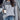 Women's chic streetwear gray half-zip pullover with leopard print, quilted design, worn by model with black hairstyle, showcasing shoulder and outerwear fashion.