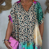Leopard Print V-Neck Blouse with Lightweight Short Sleeves in Green and White Textiles, showcasing fashion-forward design with a comfortable fit around the shoulder and waist.