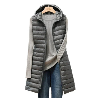 Light beige slim fit women's hooded quilted winter coat with a gray hue, featuring long sleeves and a stylish collar design, displayed on a mannequin against a plain background.