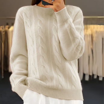 Light blue cable knit crewneck sweater for women, showcasing a cozy winter fashion style. The sweater features long sleeves and a comfortable fit, ideal for cold weather.