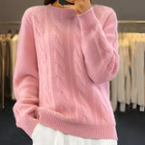 Light blue cable knit crewneck sweater for women showcasing the cozy winter fashion design with detailed shoulder and sleeve textures.