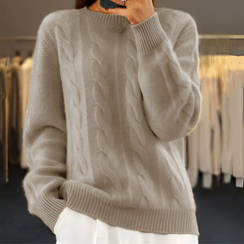 Cozy women's winter fashion featuring a light blue cable knit crewneck sweater in a khaki color, available in XL size. The sweater showcases a classic design with a soft texture, long sleeves, and a comfortable fit, perfect for a stylish yet warm look during the colder months.