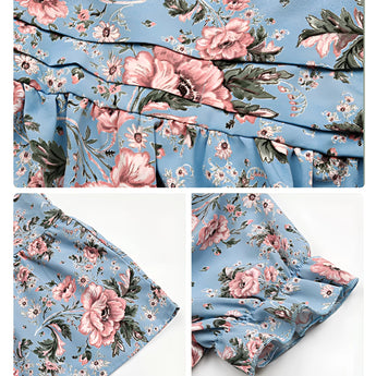 Light blue floral midi dress with a V-neck and short sleeves, designed for summer beachwear, showcasing a delicate flower pattern.
