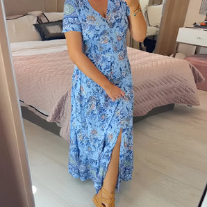 Light blue floral V-neck maxi dress with a side split, designed for women's summer fashion, highlighting comfort and style with attention to neckline, waist, and sleeve details.