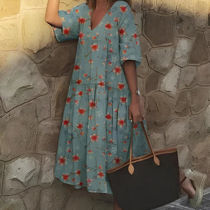 Light blue floral V-neck summer dress with side pockets, casual midi length, sky blue color, size 5XL, displayed on a mannequin.