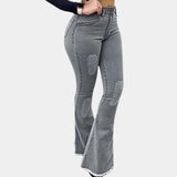 Light blue high waist flare jeans in a retro stretch bell-bottom style, shown in a gray color variant. The jeans are paired with a blazer, highlighting the waist and thigh area, with a focus on the denim fabric. Suitable for size XL.