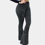 Light blue high waist flare jeans with a retro bell bottom design, showcasing a stretchy denim fabric. The jeans have a fitted waist and thigh, flaring out at the knee to create a classic 1970s silhouette.