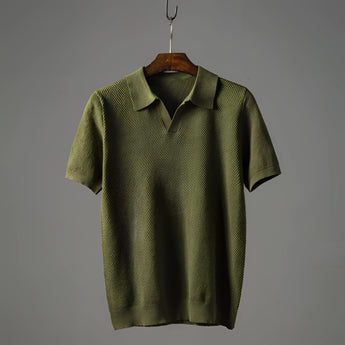 Light blue men's polo shirt with a grey collar, featuring a breathable fabric suitable for business casual attire. The shirt has a button-up front and short sleeves, designed with a sleek fashion-forward style.