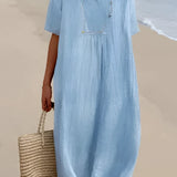 Light blue oversized linen beach dress with a V-neck design, shown in size 2XL. The dress features a loose, relaxed fit perfect for summer fashion, complemented by short sleeves and a comfortable waistline.