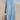Light blue oversized linen beach dress with a V-neck design, shown in size 2XL. The dress features a loose, relaxed fit perfect for summer fashion, complemented by short sleeves and a comfortable waistline.