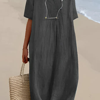 Light gray oversized linen beach dress with a V-neck design, featuring short sleeves and a relaxed fit. The dress is styled for summer fashion and appears to be in a 2XL size.