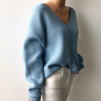 Light blue oversized V-neck knit sweater for women, showcasing a casual chic style with long sleeves and a relaxed fit.