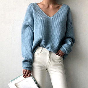 Light blue oversized V-neck knit sweater for women featuring a casual chic style, with long sleeves and a relaxed fit.
