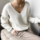 Light blue oversized V-neck knit sweater for women, showcasing a casual chic style with long sleeves and a comfortable, relaxed fit.
