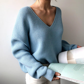 Light blue oversized V-neck knit sweater on a mannequin showcasing the casual chic women's pullover with long sleeves and a relaxed fit.
