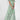 Light blue floral maxi dress with ruffle sleeves, featuring a chiffon fabric and a summer gown style, shown in a green color for size 3XL.