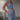 
A light blue sleeveless high-waist formal jumpsuit featuring a backless design, displayed on a mannequin. The jumpsuit has a fitted waist, wide legs, and a sophisticated appearance suitable for formal occasions.